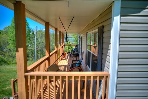 Relax on this porch swing, enjoying the fresh mountain air.
