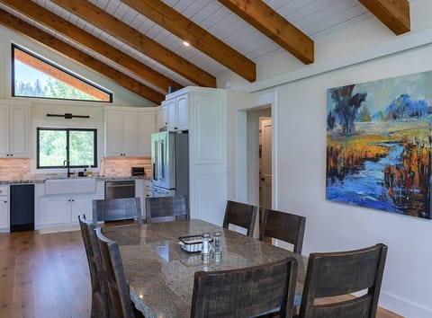 Dining area with seating for 8 guests.