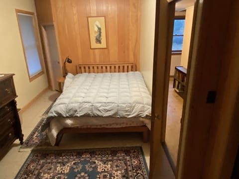 Main bedroom with queen bed and a futon. 