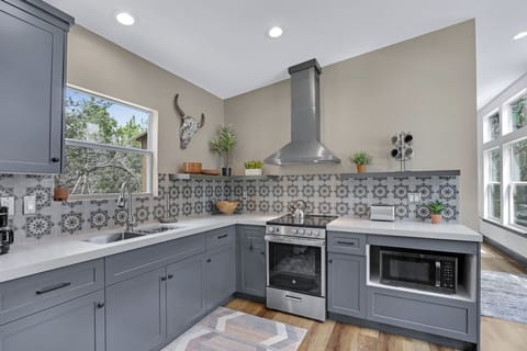 Stainless appliances-- range with oven and microwave.