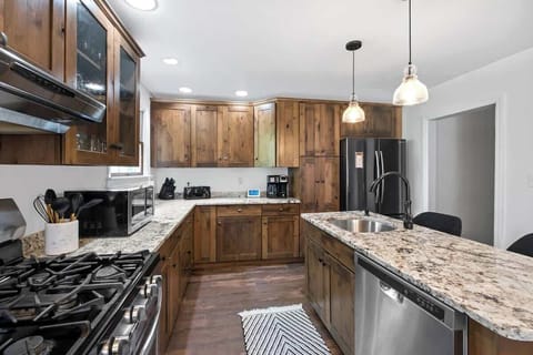 Cook, dine, and enjoy in this stylish kitchen, complete with all the essentials for a perfect stay.