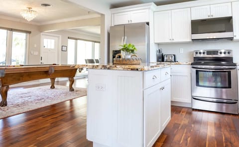 Embrace Togetherness with Board Games and a Center Table in Our Kitchen, Creating a Warm Space for Shared Laughter and Memories.