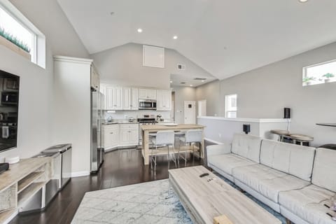 Open concept living room, dining room, and kitchen