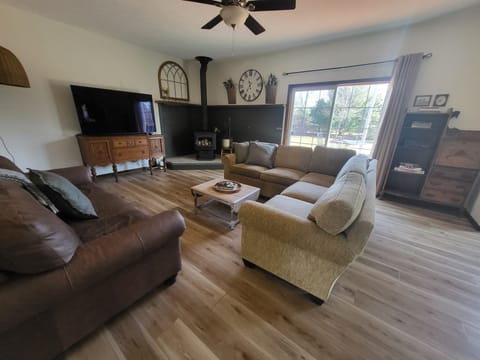 living room with 65" smart tv 