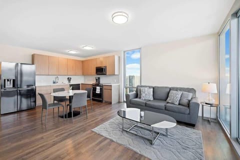 Cozy sofa with a breathtaking view of the city skyline; the perfect relaxation spot