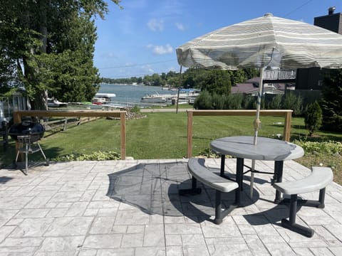 Outdoor patio with large yard and firepit