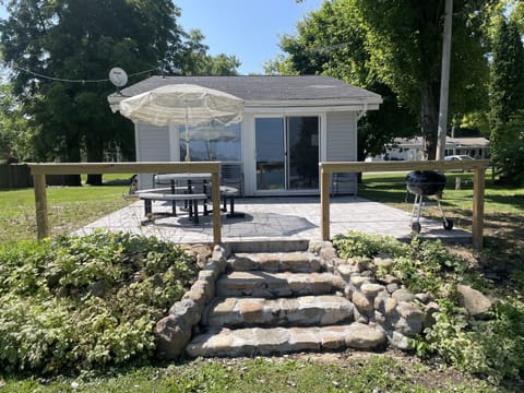New concrete patio, sitting area facing beautiful Crystal Lake