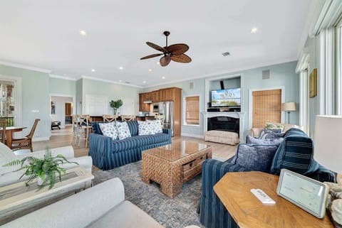 Soak in stunning views from this bright, airy living room. Lounge on the plush sofa, bask in natural sunlight, and step right onto the balconies—your perfect coastal escape awaits.