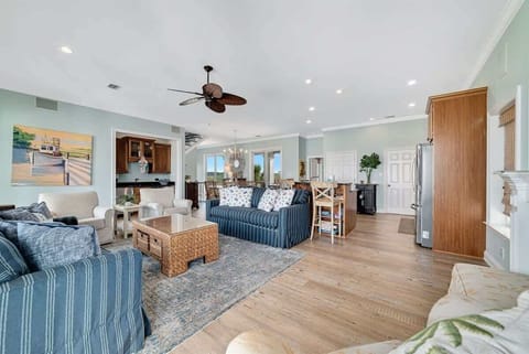 Soak in stunning views from this bright, airy living room. Lounge on the plush sofa, bask in natural sunlight, and step right onto the balconies—your perfect coastal escape awaits.