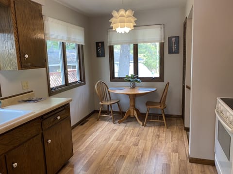 Breakfast nook w/corner pantry for more food/cooking storage.