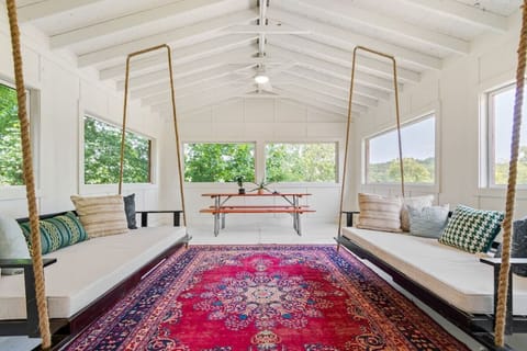Bright and colorful porch space perfect for card games, eating at the picnic table, or relaxing with your morning coffee.