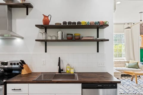 Fully stocked & well-lit kitchen for all your cooking needs, just off of the living room.
