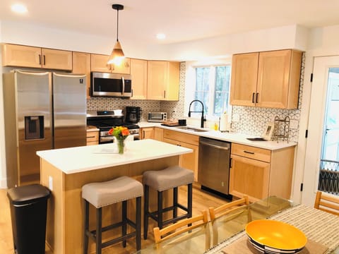 Two countertop stools provide additional seating