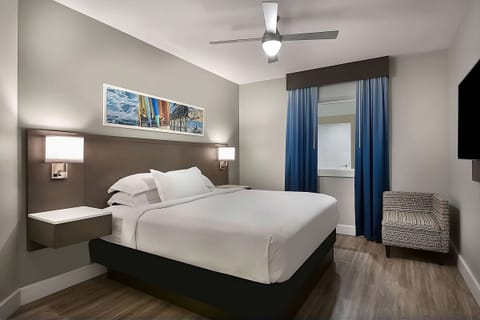 Drift off comfortably beneath soft lighting and cool ocean tones.
