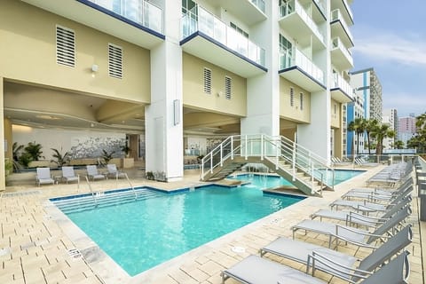 Arrive to a striking high-rise steps from the shoreline.