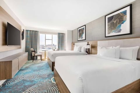 Unit with 2 Queen beds. Exact unit will be assigned upon arrival. Views, colors, and decor may vary.