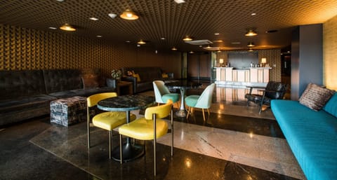 Kick back in a speakeasy-style lounge with intimate evening ambiance.