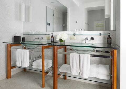 Refresh with dual sinks, bright mirrors, and spa-clean towels.