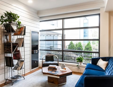 Sip morning coffee beside oversized windows and city views.