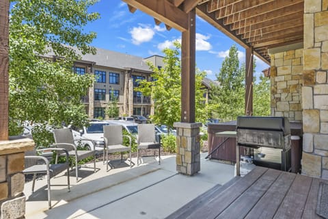- Step outside to a covered patio with chairs and BBQ grill ready  
- Relax by the hot tub or enjoy outdoor dining with fresh air  
- Perfect spot for gatherings with seating and shaded comfort