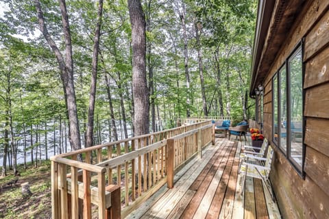 Deck overlooking lake and access to main door.