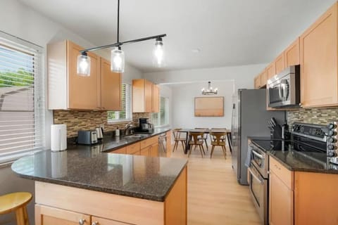 Open concept style view from kitchen towards dinning room