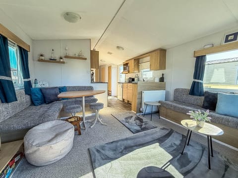 Cosy up next to the fireplace with your furry friend in this pet friendly caravan after a day of exploring by the Hunstanton beach.