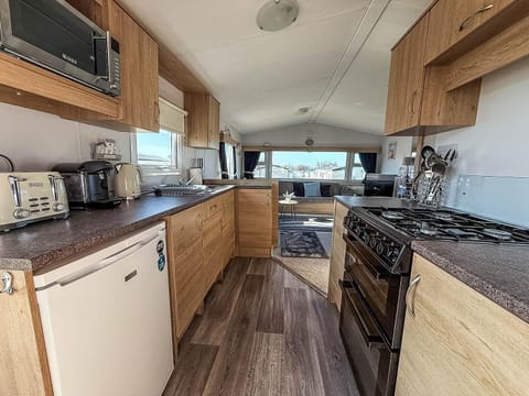 Compact yet equipped open caravan kitchen for all of your culinary needs.