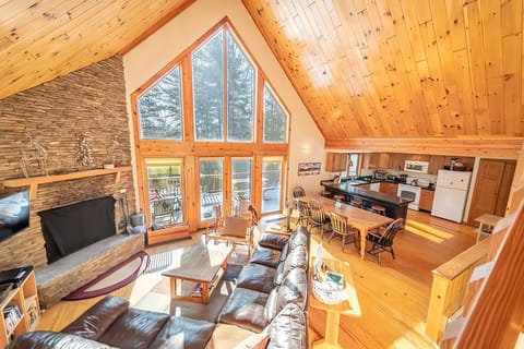 Large dining table sits 8 plus 4 seats at the counter