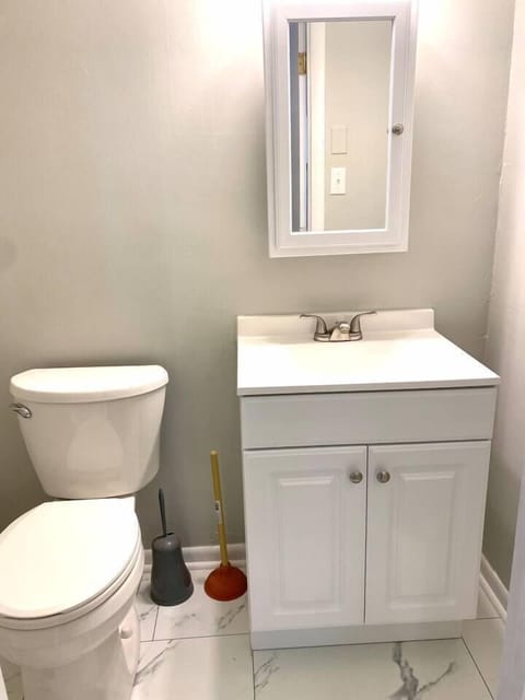 Half-bath, located in the primary bedroom.