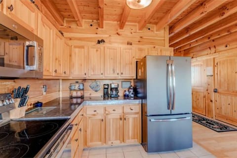Kitchen with stainless refrigerator, oven, dishwasher, and microwave