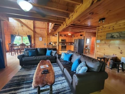 Open concept living room, dining room, kitchen all overlooking mountain view