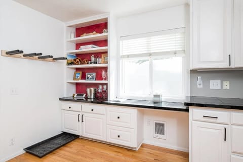 Kitchen storage space and window over deck