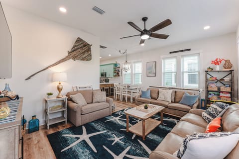 The living room features plenty of seating.