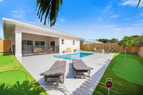 Custom Five-Hole Turf Mini Golf Course and Heated Saltwater Pool Area
