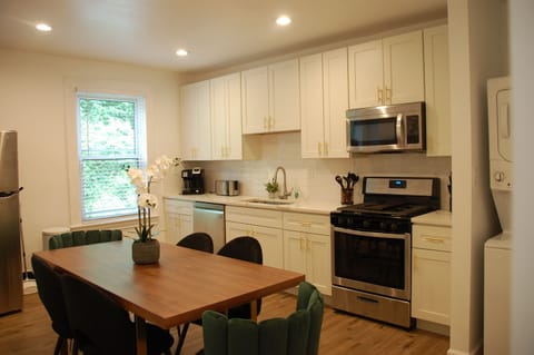 Kitchen and dining area with granite countertop and stainless appliances