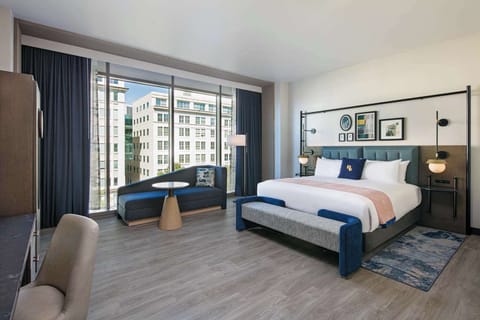 Wake up to sunlit comfort and sweeping downtown window views.