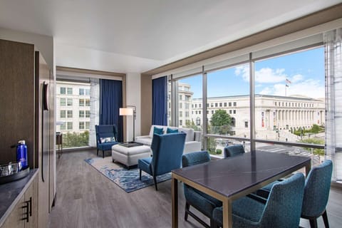 Unwind by wraparound windows with sweeping city views.
