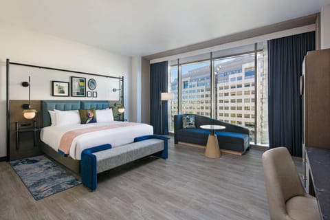 Unwind in a bright king room with skyline views.