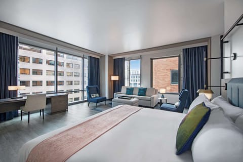 Wake up to daylight and skyline views from bed.