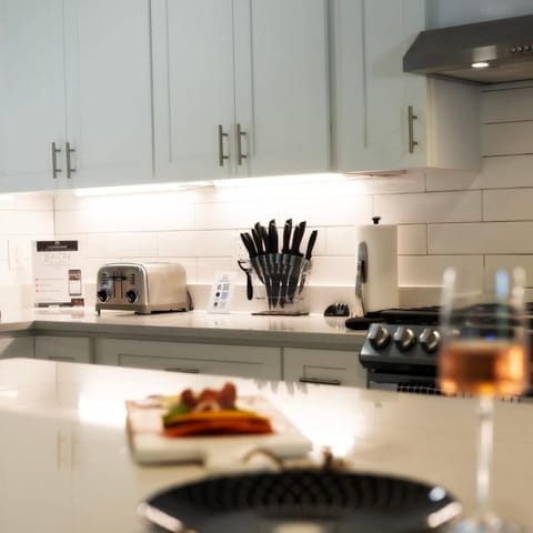 A fully functional kitchen —equipped with modern appliances, stocked cabinets, cookware, utensils, and a coffee maker. Perfect for home-cooked meals, morning brews, and effortless entertaining