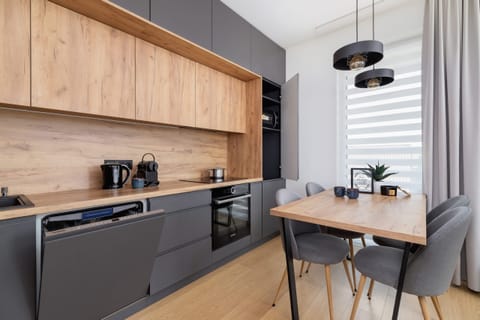 Kitchenette with oven and refrigerator.