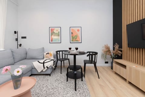 Living room with a comfortable sofa and TV. 