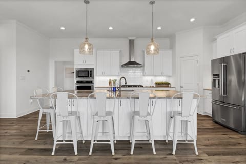 Gather around this large kitchen bar for great conversation.