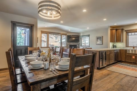 Gather around the table with mountain light and easy flow between kitchen and living spaces.