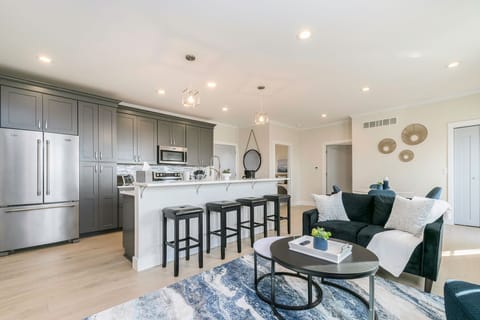 Savor the joy of culinary delights at our inviting open kitchen and stylish bar counter.