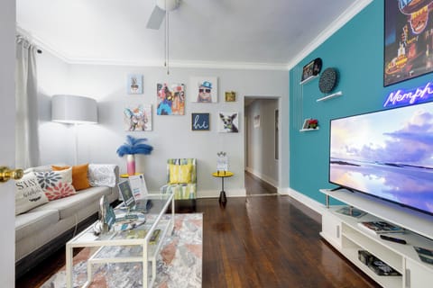 LIVING ROOM features 58 inches smart TV and a sleeper sofa