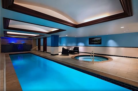 Unwind with a nighttime swim beside the soothing spa.
