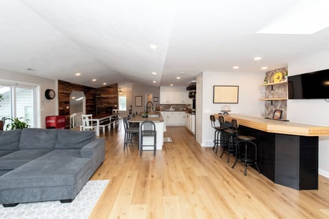 Relax in this stunning open-concept space where your kitchen, dining, and living areas flow seamlessly together on beautiful hardwood floors.