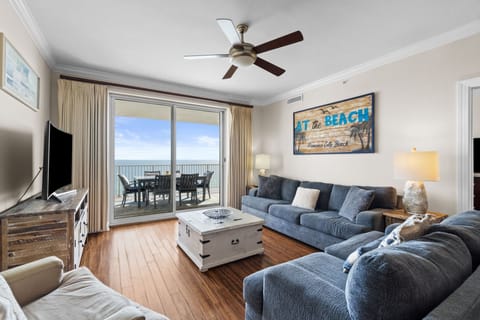 The room is finished with a TV and dresser, providing storage and entertainment.